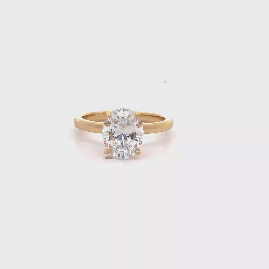 GOLD OVAL SOLITAIRE RING WITH ZIRCONIA